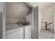 Efficient laundry room with washer and dryer, seamlessly integrated into a convenient home area at 5675 S Crocker St, Littleton, CO 80120