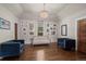 Cozy living room with hardwood floors, a crystal chandelier, and a gallery wall at 5675 S Crocker St, Littleton, CO 80120