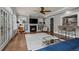 Bright living room features fireplace, built-in shelving, hardwood floors, and lots of windows at 5675 S Crocker St, Littleton, CO 80120