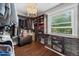 Spacious walk-in closet with built-in shelving, providing ample storage and a custom organization system at 5675 S Crocker St, Littleton, CO 80120