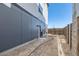 Exterior shot of the backyard with a newly constructed fence and rear of a modern home at 10863 E Hinsdale Cir, Centennial, CO 80112