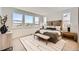 Bright bedroom with large windows, a plush bed, and stylish modern decor at 10863 E Hinsdale Cir, Centennial, CO 80112