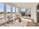 Bright living area with modern furnishings, large windows, and sliding door leading to outdoor space at 10863 E Hinsdale Cir, Centennial, CO 80112