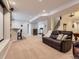 Spacious basement featuring a bar area, comfy sofa, and stairs at 11074 Grayledge Cir, Highlands Ranch, CO 80130