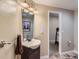 Bathroom featuring a vanity sink and mirror in neutral tones at 11074 Grayledge Cir, Highlands Ranch, CO 80130