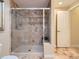 Tile shower with glass doors at 11074 Grayledge Cir, Highlands Ranch, CO 80130