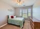 Bedroom featuring a window with natural light overlooking the backyard and neutral carpeted floors at 11074 Grayledge Cir, Highlands Ranch, CO 80130