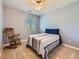 Bedroom with neutral walls, carpet flooring, and a window with natural light overlooking the backyard at 11074 Grayledge Cir, Highlands Ranch, CO 80130