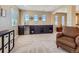 Bonus room featuring a bar with a beverage refrigerator and ample cabinetry for storage at 11074 Grayledge Cir, Highlands Ranch, CO 80130