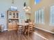 Bright dining room features hardwood floors, modern lighting, and custom wood hutch for a great dining experience at 11074 Grayledge Cir, Highlands Ranch, CO 80130