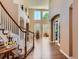 Grand foyer featuring soaring ceilings, hardwood floors, and an elegant staircase at 11074 Grayledge Cir, Highlands Ranch, CO 80130