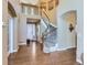 Spacious foyer featuring hardwood floors, staircase, and a grand entrance at 11074 Grayledge Cir, Highlands Ranch, CO 80130