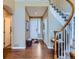 Inviting foyer with hardwood floors, a staircase, and a welcoming atmosphere at 11074 Grayledge Cir, Highlands Ranch, CO 80130
