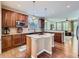 Modern kitchen features wood cabinets, granite countertops, and an island with stainless steel appliances at 11074 Grayledge Cir, Highlands Ranch, CO 80130