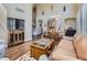 Comfortable living room featuring hardwood floors, stylish furniture, and natural light at 11074 Grayledge Cir, Highlands Ranch, CO 80130