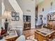 Cozy living room with tall ceilings, hardwood floors, and a neutral color scheme at 11074 Grayledge Cir, Highlands Ranch, CO 80130