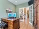 Home office with hardwood floors, french doors, and a view into the home entryway at 11074 Grayledge Cir, Highlands Ranch, CO 80130