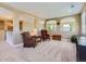 Upstairs sitting area with arched entryways and natural light from the windows overlooking the backyard at 11074 Grayledge Cir, Highlands Ranch, CO 80130