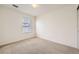 Spacious bedroom with neutral carpeting and large window at 5833 N Biscay St, Denver, CO 80249