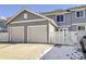 Two-car garage with a private fenced yard at 5833 N Biscay St, Denver, CO 80249