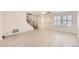 Bright living room with laminate floors and stairs at 5833 N Biscay St, Denver, CO 80249