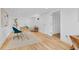 Finished basement space with wood floors, a closet, and a functional desk area at 1420 E Bates Ave, Englewood, CO 80113