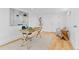 Finished basement with a functional desk area, natural light, and contemporary artwork at 1420 E Bates Ave, Englewood, CO 80113