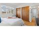 Bedroom with a large window and closet space, offering both comfort and storage at 1420 E Bates Ave, Englewood, CO 80113
