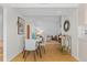 Modern dining area with stylish chairs, a glass table, and seamless flow into the living room at 1420 E Bates Ave, Englewood, CO 80113