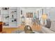 Bright dining room and living area featuring open shelves and modern decor, enhanced by natural light at 1420 E Bates Ave, Englewood, CO 80113
