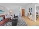Bright entryway leading into the living space with a view of dining area, featuring modern decor at 1420 E Bates Ave, Englewood, CO 80113