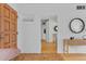 Open foyer with tile flooring, white walls, wood door, and modern decor at 1420 E Bates Ave, Englewood, CO 80113