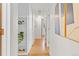 Bright hallway featuring built-in shelving and an art display at 1420 E Bates Ave, Englewood, CO 80113