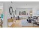 Bright living room with large windows, modern decor, and neutral color palette at 1420 E Bates Ave, Englewood, CO 80113