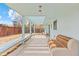 Covered patio features an outdoor seating area and a pergola overlooking the backyard at 1420 E Bates Ave, Englewood, CO 80113