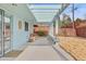 Long covered patio with stylish seating and an open view of the expansive backyard at 1420 E Bates Ave, Englewood, CO 80113