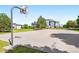 Community basketball court with a well-kept surface, situated near residential buildings and green spaces for active living at 3242 E 103Rd Dr # 602, Thornton, CO 80229