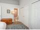 Bright room features a closet, sliding door and view into the bathroom at 3242 E 103Rd Dr # 602, Thornton, CO 80229
