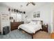 Stylized bedroom with a queen-sized bed, decor, and natural light from the window at 3242 E 103Rd Dr # 602, Thornton, CO 80229