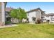 Charming townhome featuring stone accents, private balconies, and a well-maintained lawn, set in a serene neighborhood at 3242 E 103Rd Dr # 602, Thornton, CO 80229