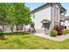 Charming townhome featuring stone accents and well-maintained lawn, set in a serene neighborhood at 3242 E 103Rd Dr # 602, Thornton, CO 80229