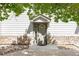 Inviting front entrance with gray door, stone accents, and a charming overhang, creating a welcoming curb appeal at 3242 E 103Rd Dr # 602, Thornton, CO 80229