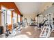 Well-equipped fitness center with a variety of modern exercise machines and natural light, promoting a healthy lifestyle at 3242 E 103Rd Dr # 602, Thornton, CO 80229
