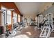 Well-equipped gym with weight machines, treadmill, elliptical, and mounted TVs for residents at 3242 E 103Rd Dr # 602, Thornton, CO 80229