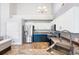 Bright kitchen features stainless steel appliances and white cabinets with gold hardware at 3242 E 103Rd Dr # 602, Thornton, CO 80229