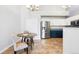 Bright kitchen featuring stainless steel appliances and views of the dining area at 3242 E 103Rd Dr # 602, Thornton, CO 80229
