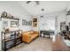 Bright living room features a sofa, carpet flooring, and natural light from the window at 3242 E 103Rd Dr # 602, Thornton, CO 80229