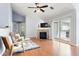 Bright living room with fireplace, ceiling fan, and sliding door access to the balcony at 3242 E 103Rd Dr # 602, Thornton, CO 80229