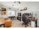Office area with large screen, work space, and a vaulted ceiling at 3242 E 103Rd Dr # 602, Thornton, CO 80229