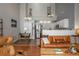 Spacious living area showcasing an open layout, modern decor, and stainless steel appliances at 3242 E 103Rd Dr # 602, Thornton, CO 80229